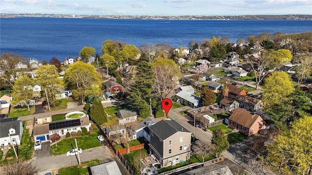 aerial view with a water view and a residential view