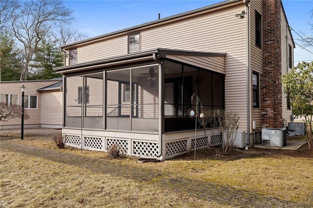 10 Eastgate Dr, Coventry, RI 02816 - exterior space featuring a chimney, cooling unit, and a sunroom