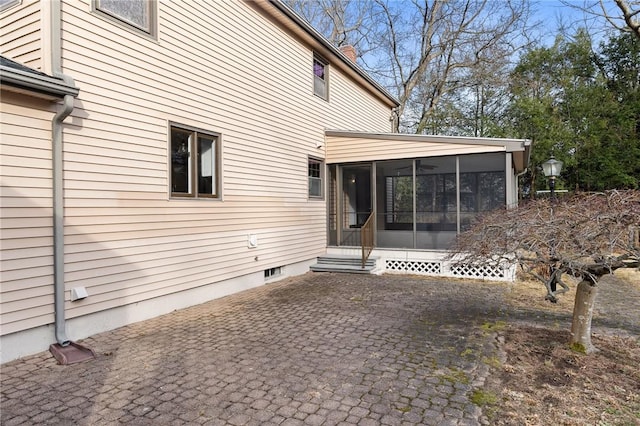10 Eastgate Dr, Coventry, RI 02816 - back of property with a sunroom and a chimney