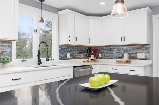 10 Eastgate Dr, Coventry, RI 02816 - kitchen featuring plenty of natural light, dishwasher, a sink, and white cabinetry