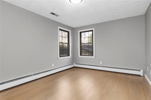 10 Eastgate Dr, Coventry, RI 02816 - unfurnished room with wood finished floors, visible vents, baseboards, and baseboard heating