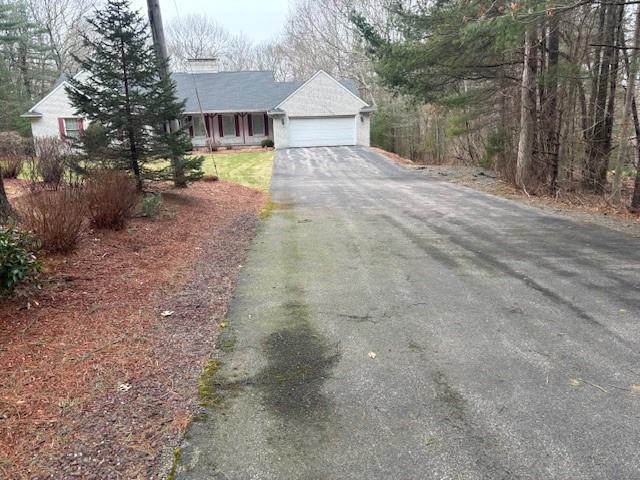 view of front of house featuring an attached garage and driveway