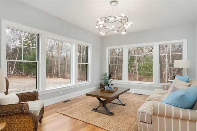 105 Princess Pine Dr, East Greenwich, RI 02818 - sunroom featuring a wealth of natural light, a notable chandelier, and visible vents