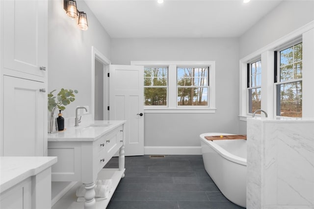 105 Princess Pine Dr, East Greenwich, RI 02818 - full bath featuring baseboards, a freestanding bath, and vanity