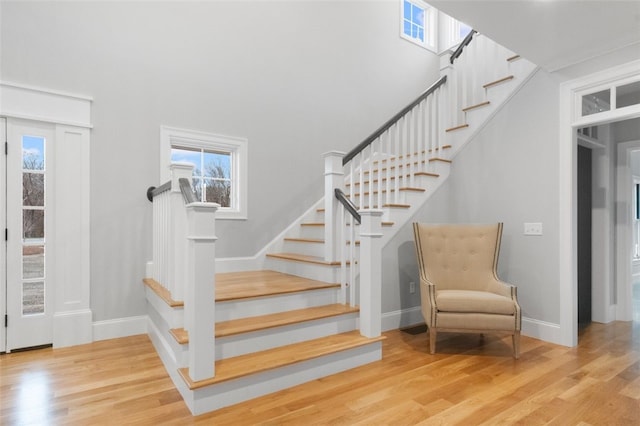 105 Princess Pine Dr, East Greenwich, RI 02818 - stairs featuring a high ceiling, wood finished floors, and baseboards