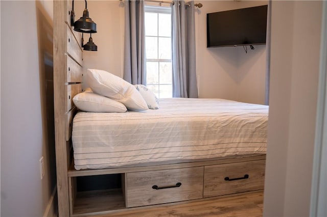 bedroom with wood finished floors