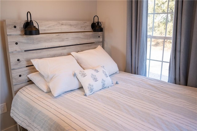 bedroom featuring multiple windows