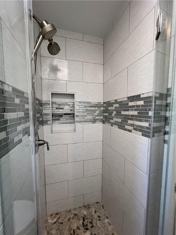 full bathroom featuring a stall shower