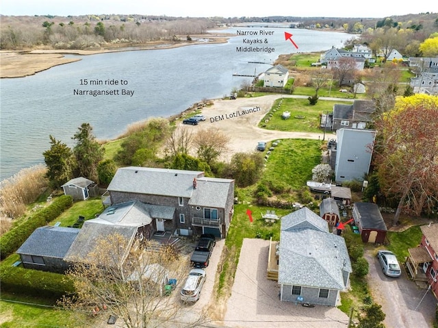 birds eye view of property featuring a residential view and a water view