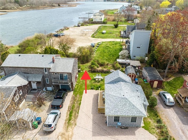 birds eye view of property featuring a water view