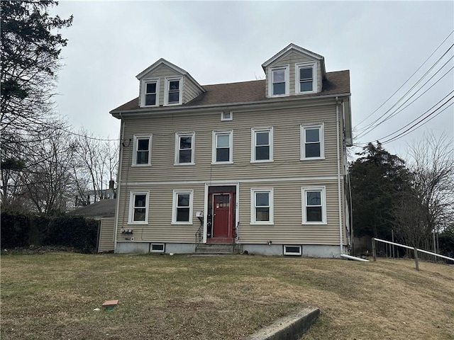 view of front of home with a front yard and entry steps