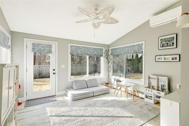 sunroom / solarium with a wall mounted AC and a wealth of natural light