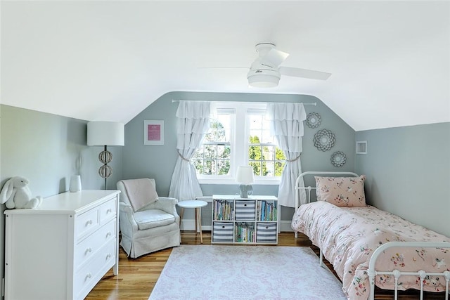 bedroom featuring lofted ceiling, ceiling fan, and wood finished floors