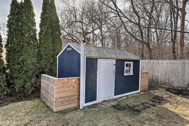 view of shed with fence