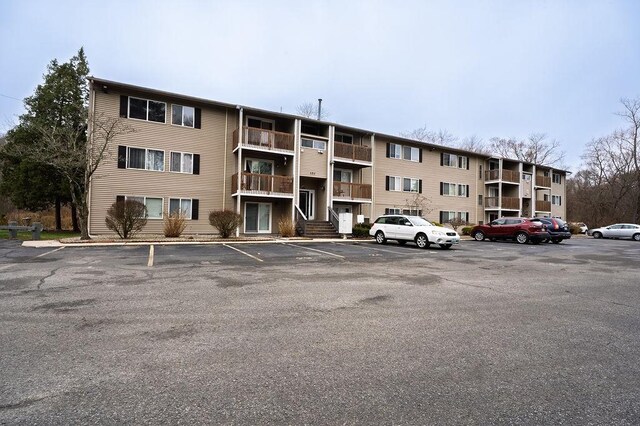 view of property with uncovered parking
