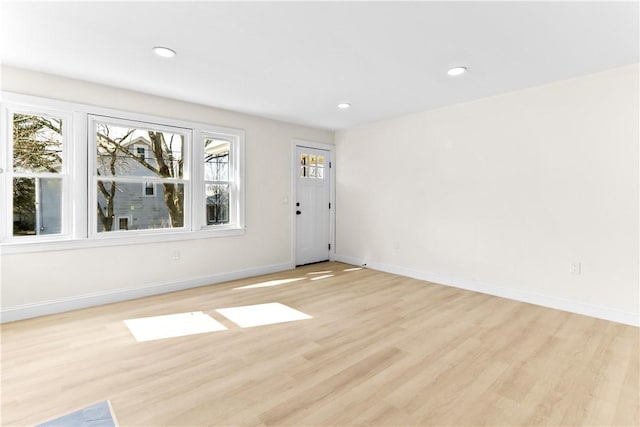 interior space with recessed lighting, baseboards, and light wood-type flooring