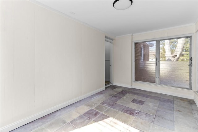empty room with baseboards and ornamental molding