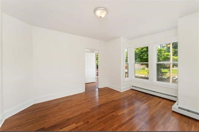 57 School St, East Providence, RI 02914 - empty room with baseboards, baseboard heating, and wood finished floors