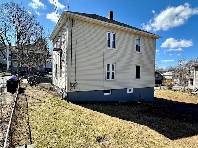 back of property with a yard
