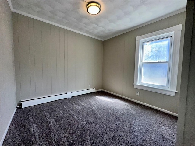 carpeted empty room with a baseboard radiator, crown molding, and baseboards
