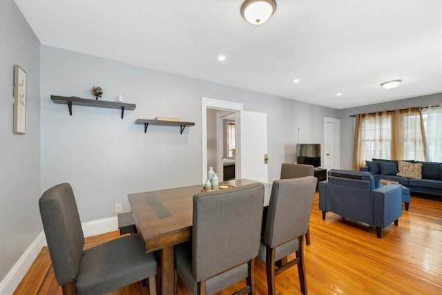 dining area featuring baseboards, recessed lighting, and light wood-style floors