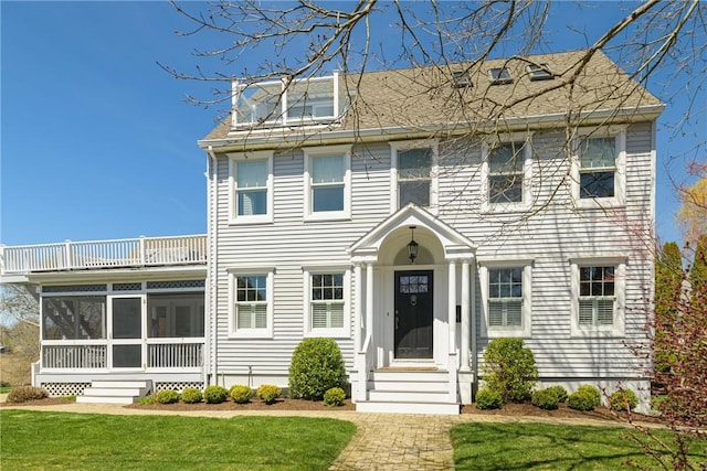 8 Key Ct, Newport, RI 02840 - colonial home with a balcony, a sunroom, and a front yard