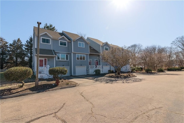 60 Margin St Unit 104, Westerly, RI 02891 - view of front facade featuring driveway and a garage
