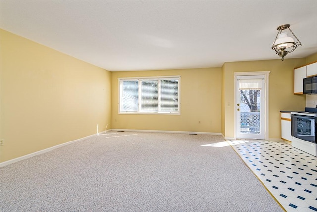 60 Margin St Unit 104, Westerly, RI 02891 - unfurnished living room featuring plenty of natural light and light carpet