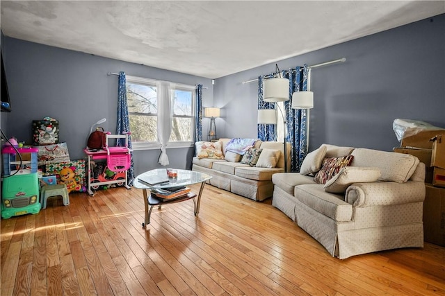 living area with hardwood / wood-style flooring