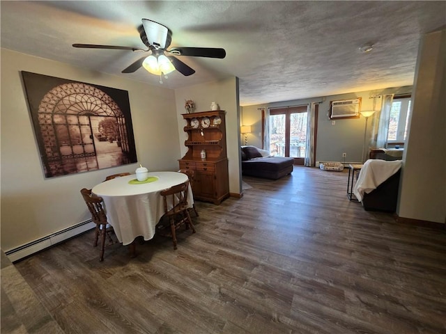 dining room with a wall unit AC, baseboard heating, a textured ceiling, a ceiling fan, and wood finished floors
