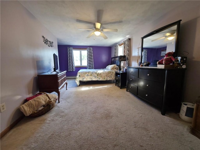 bedroom with baseboards, a ceiling fan, and light carpet