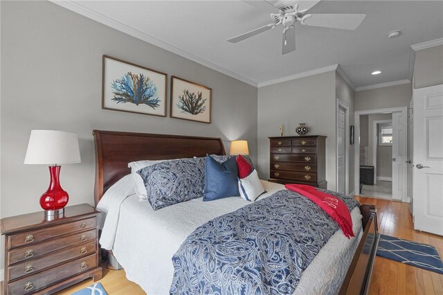 bedroom featuring crown molding, wood finished floors, recessed lighting, and a ceiling fan