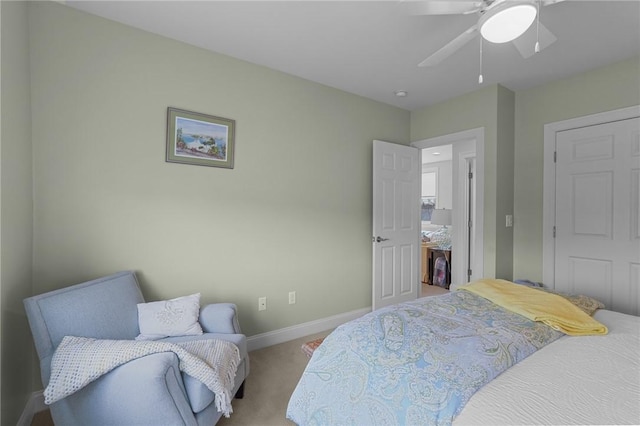 carpeted bedroom with baseboards and ceiling fan