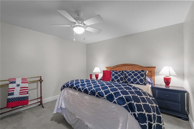bedroom with a ceiling fan, carpet, and baseboards