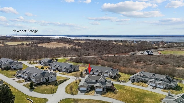 bird's eye view featuring a residential view and a water view