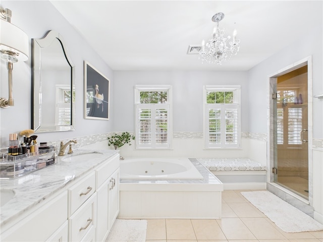 full bath featuring a sink, a chandelier, a whirlpool tub, tile patterned floors, and double vanity