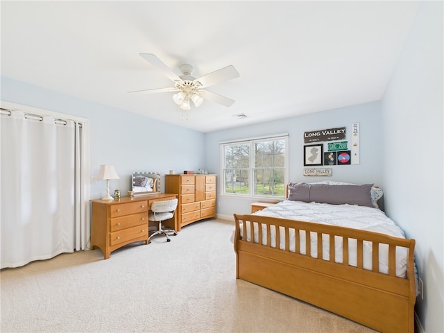 bedroom featuring visible vents, a ceiling fan, and carpet flooring