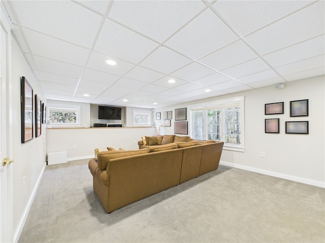 living area with recessed lighting, a paneled ceiling, carpet, and baseboards