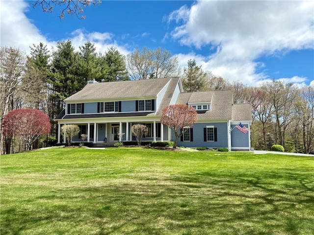 view of front of property with a porch and a front yard
