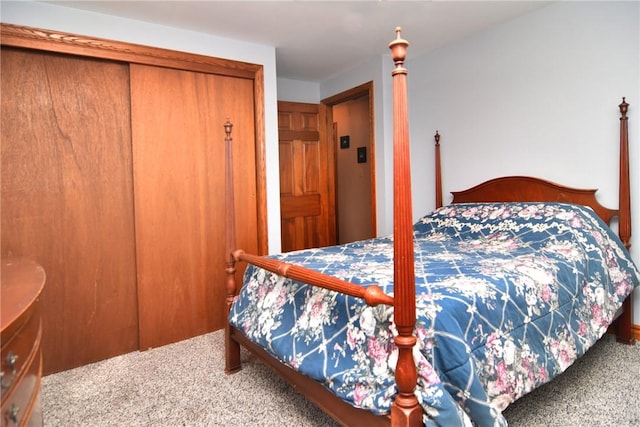 bedroom featuring a closet and carpet flooring