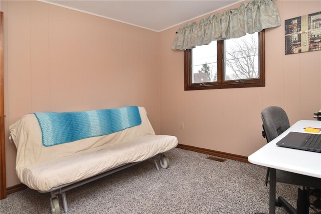 home office with baseboards, visible vents, crown molding, and carpet