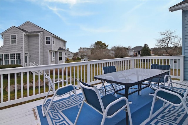 wooden deck with outdoor dining space