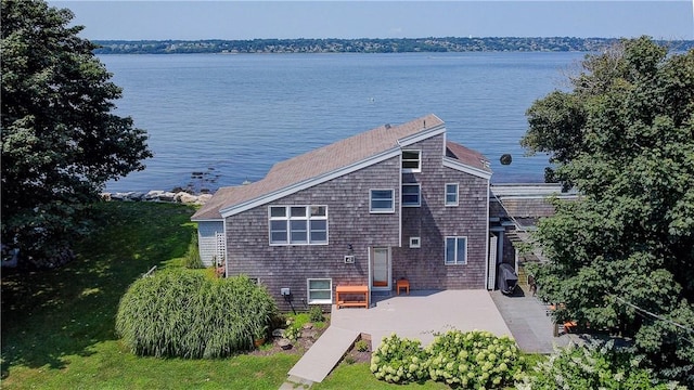 exterior space with a water view