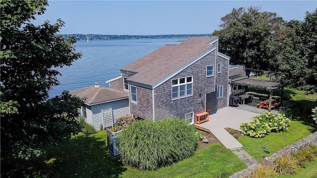 drone / aerial view featuring a water view