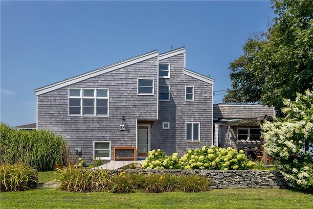 back of house with a yard