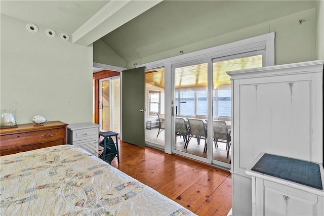 bedroom featuring access to exterior, hardwood / wood-style floors, and vaulted ceiling