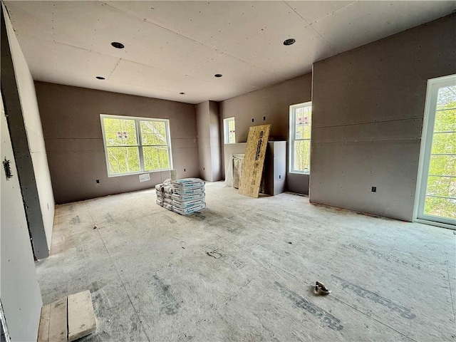 unfurnished living room with a wealth of natural light