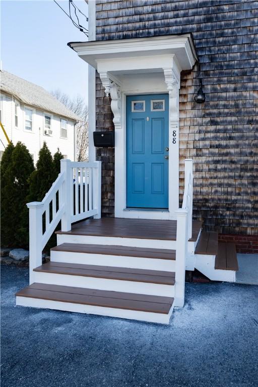view of exterior entry featuring stone siding