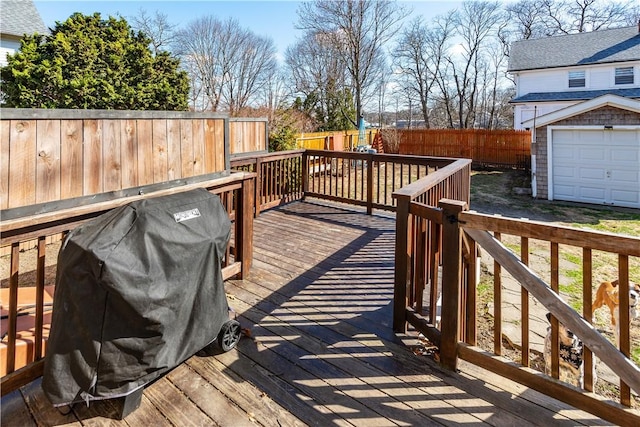deck with a fenced backyard and area for grilling