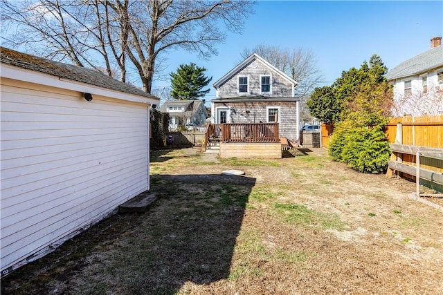 view of yard featuring a deck and fence